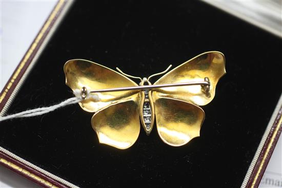 An early 20th century gold, ruby and diamond set enamelled butterfly brooch, modelled as a Red Admiral, 2in.